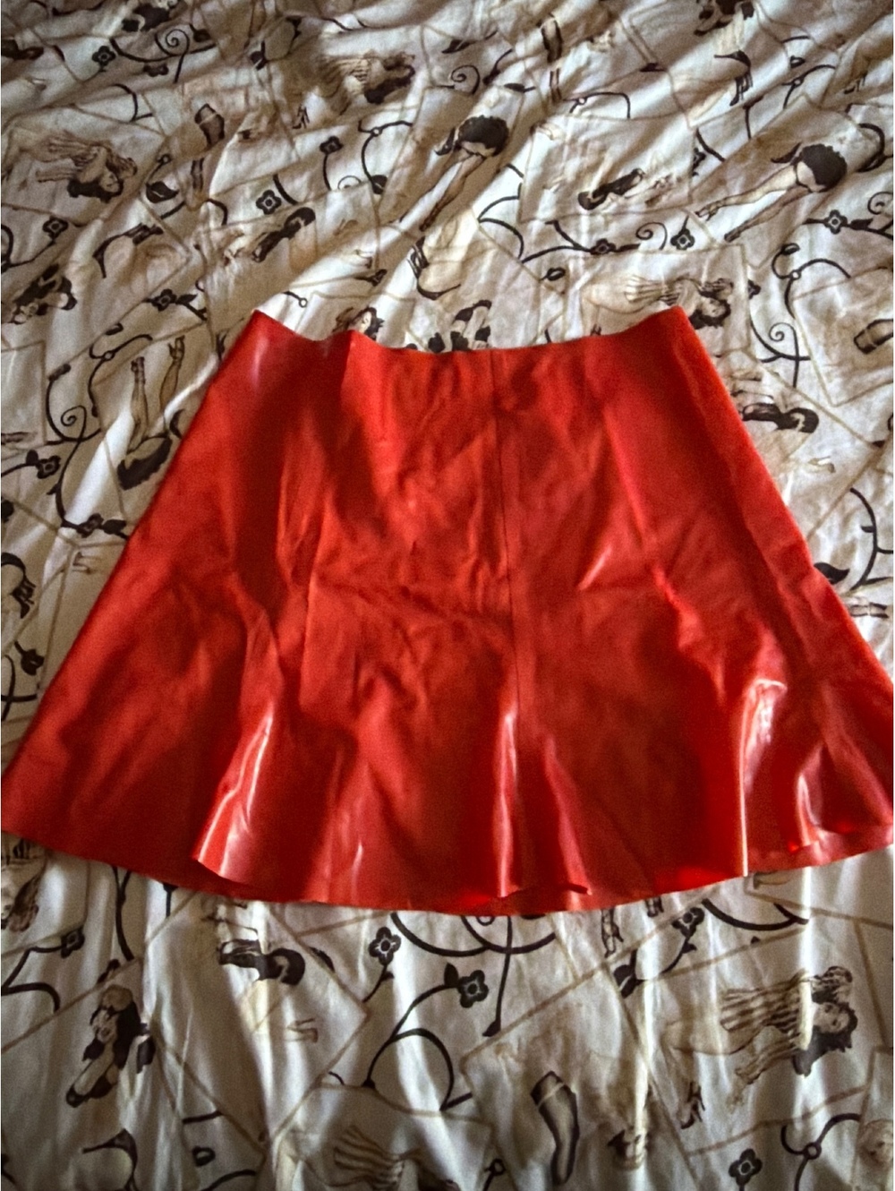 Short flared latex mini skirt